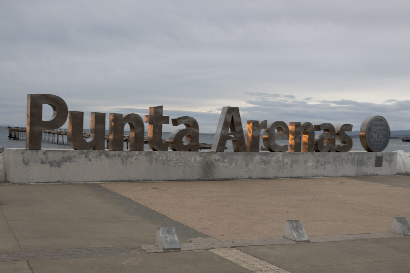 Punta Arenas 500 sign on the waterfront beside the Strait of Magellan in southern Chile