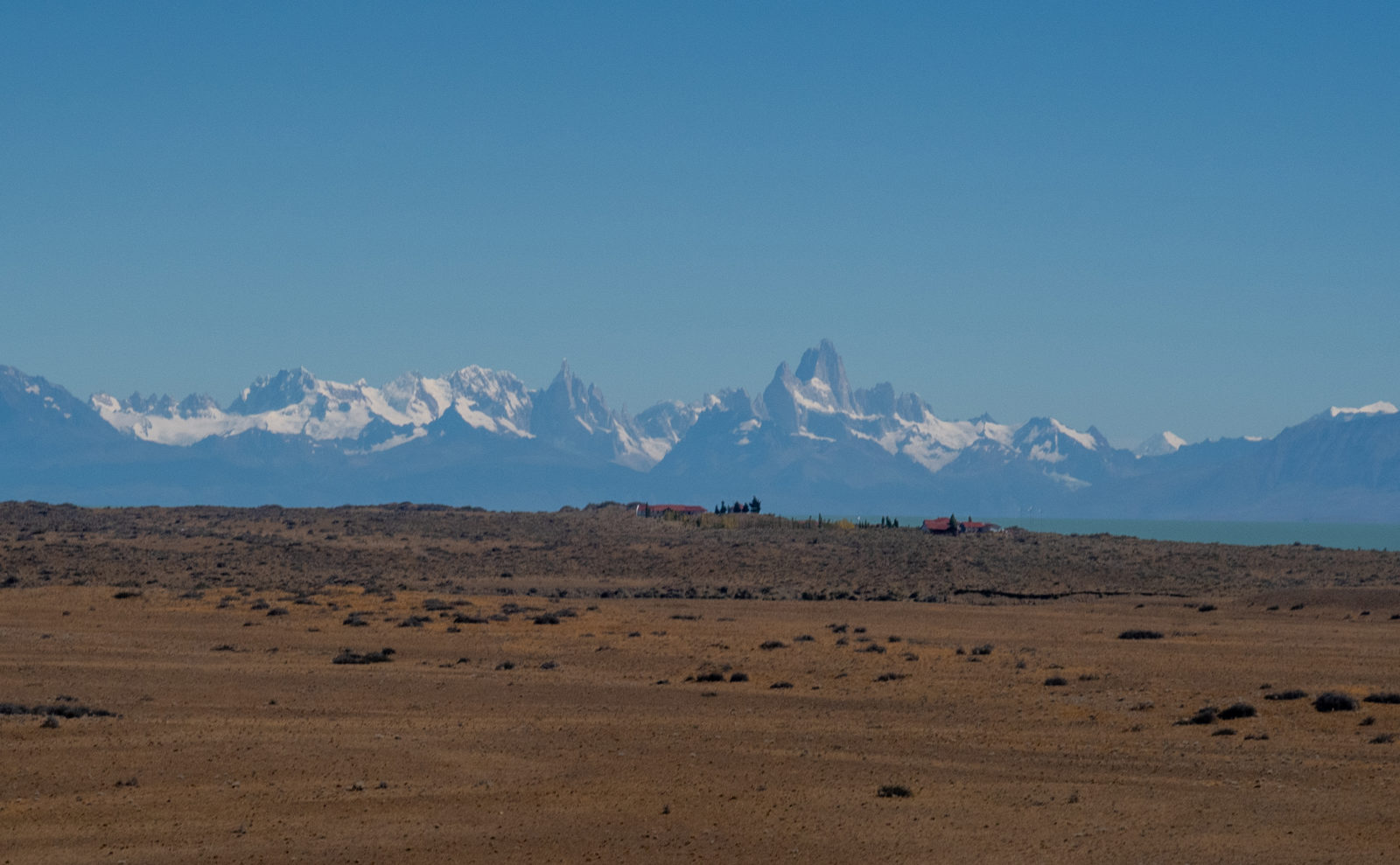 First distant view of the Fitz Roy Massif rising above the Patagonian steppe on the journey to El Chaltén, Argentina.