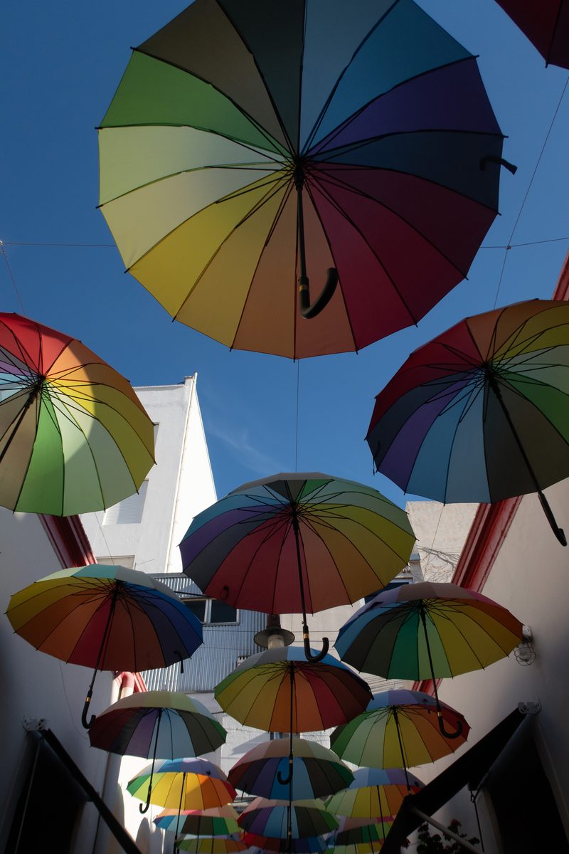 Colourful umbrellas suspended above a pedestrian passageway in San Telmo, Buenos Aires.
