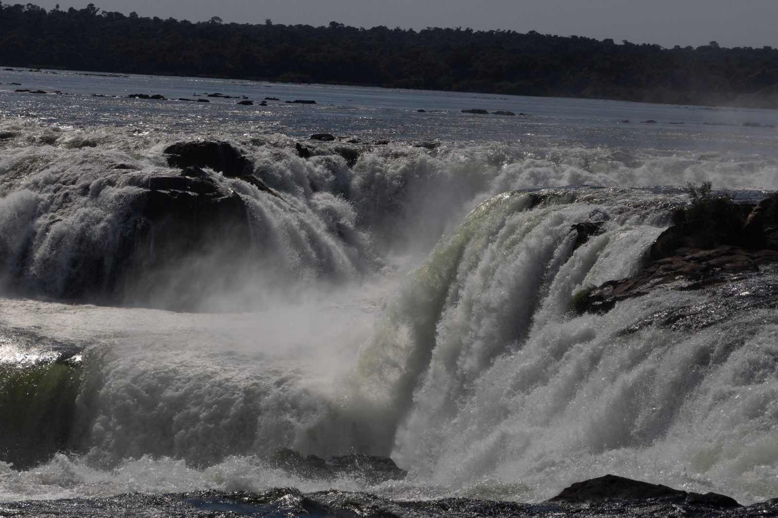 Close-up of water cascading over the rocky edge of Devil's Throat at Iguazú Falls, Argentina.