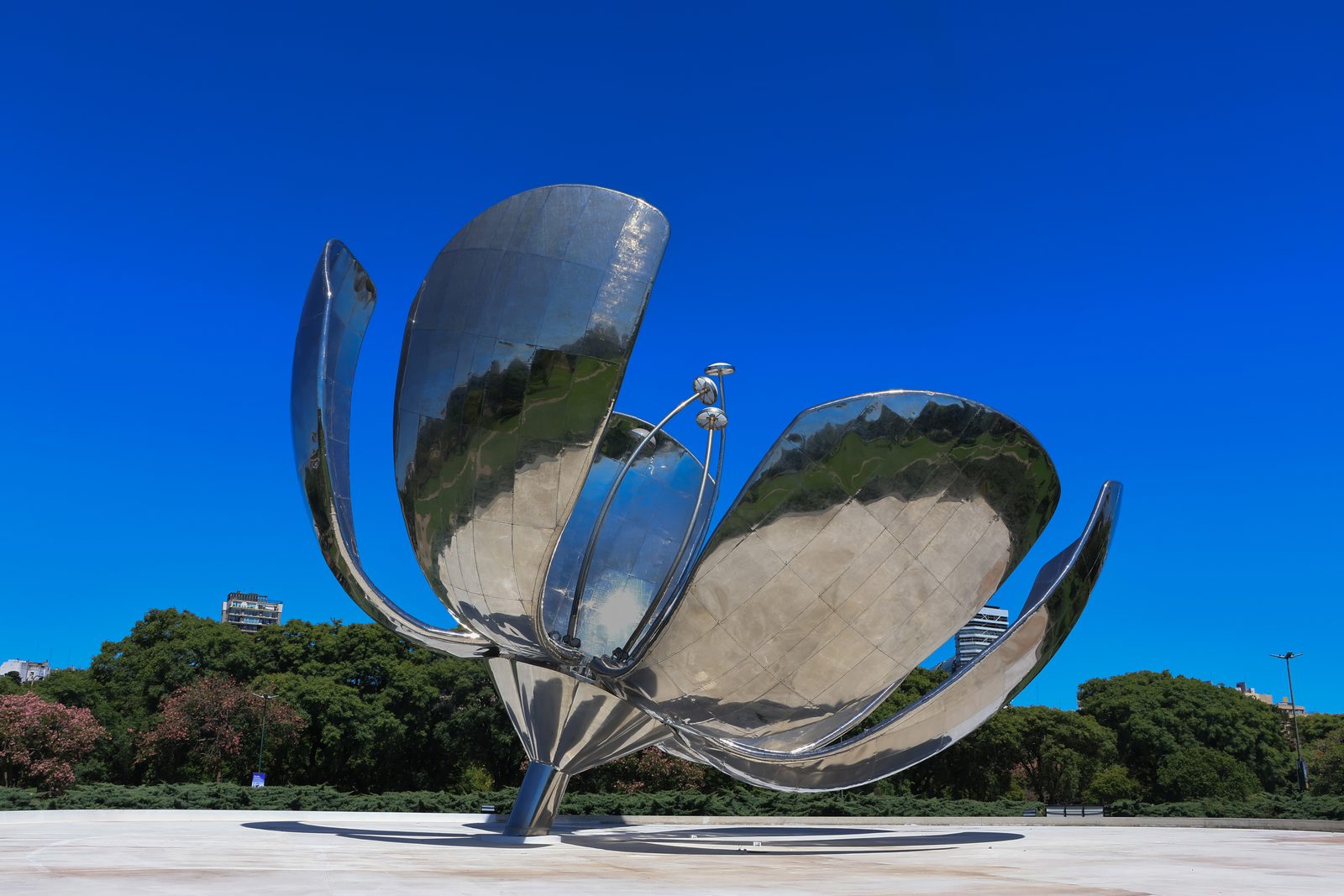 Floralis Genérica stainless steel sculpture beneath a deep blue sky in Buenos Aires, Argentina.