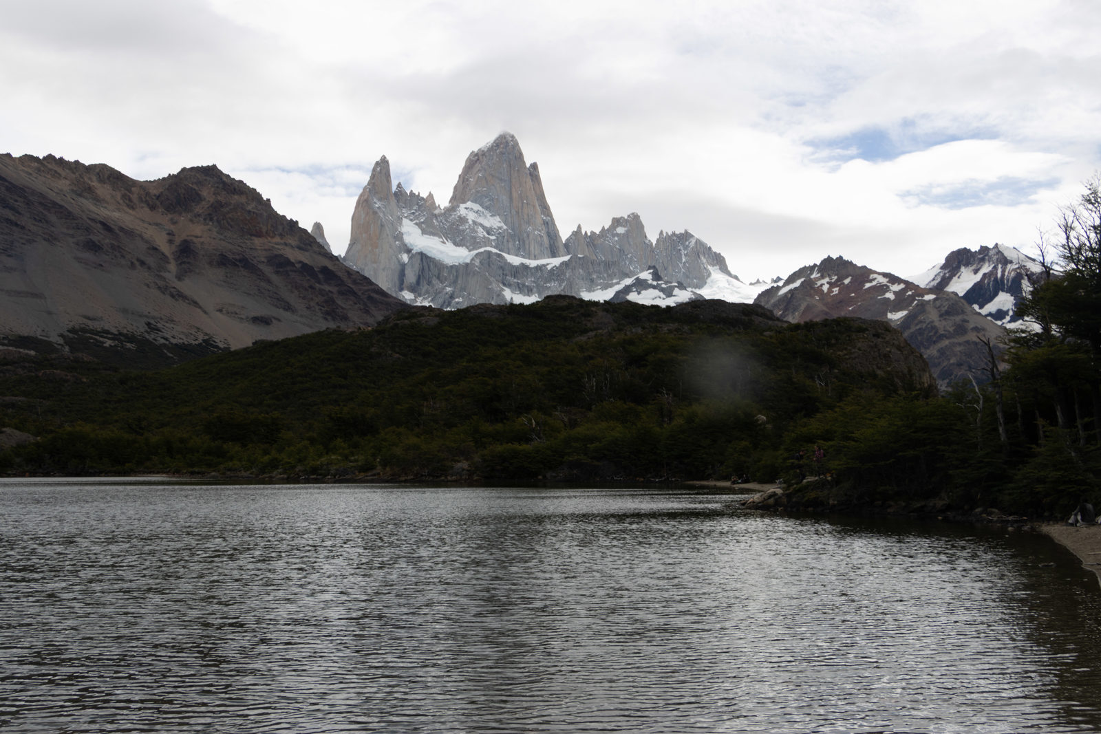 View of Fitz Roy rising behind Laguna Capri on the descent from Laguna de los Tres near El Chaltén.
