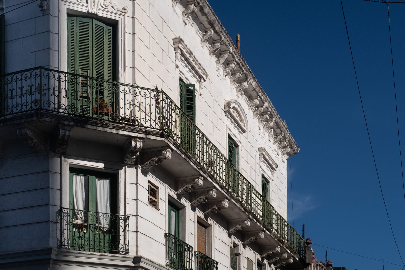 Historic building with ornate wrought-iron balconies in the San Telmo district of Buenos Aires.