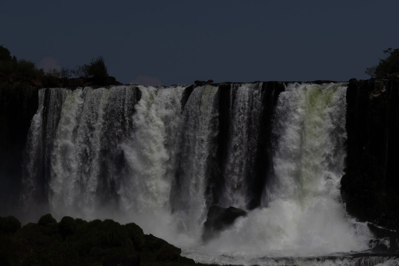 Individual waterfall cascading over the cliffs of Iguazú Falls in Argentina.
