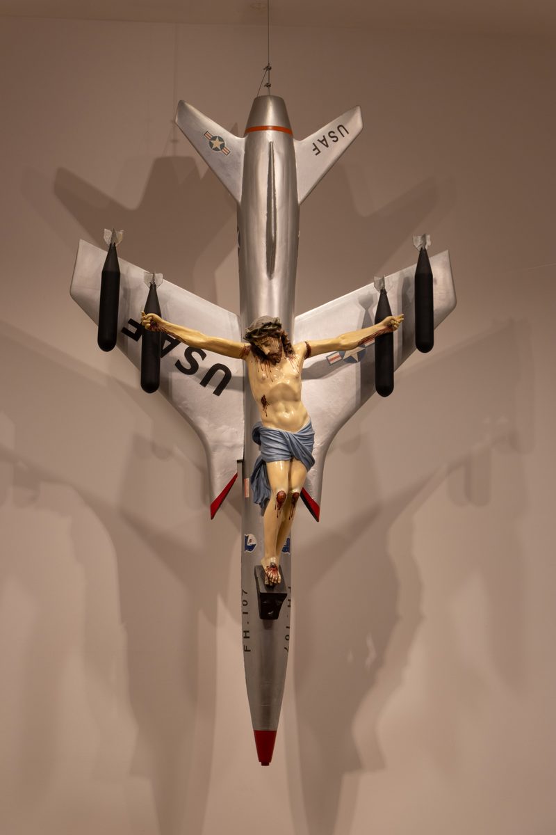 La civilización occidental y cristiana by León Ferrari, showing a crucified Christ mounted on a military aircraft, at the Museo Nacional de Bellas Artes in Buenos Aires.