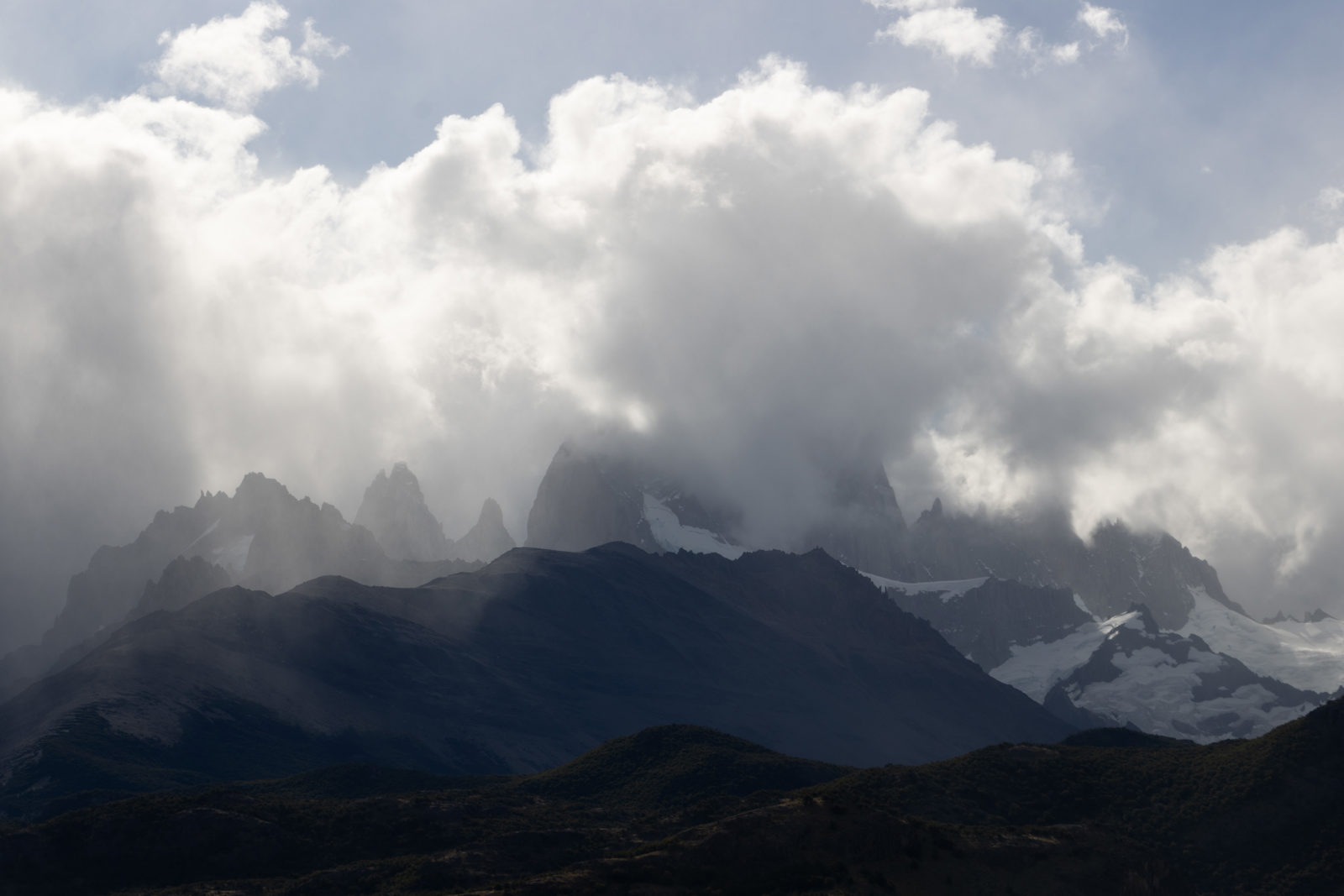 Cloud and sunlight shifting across the Fitz Roy massif above El Chaltén in Patagonia.