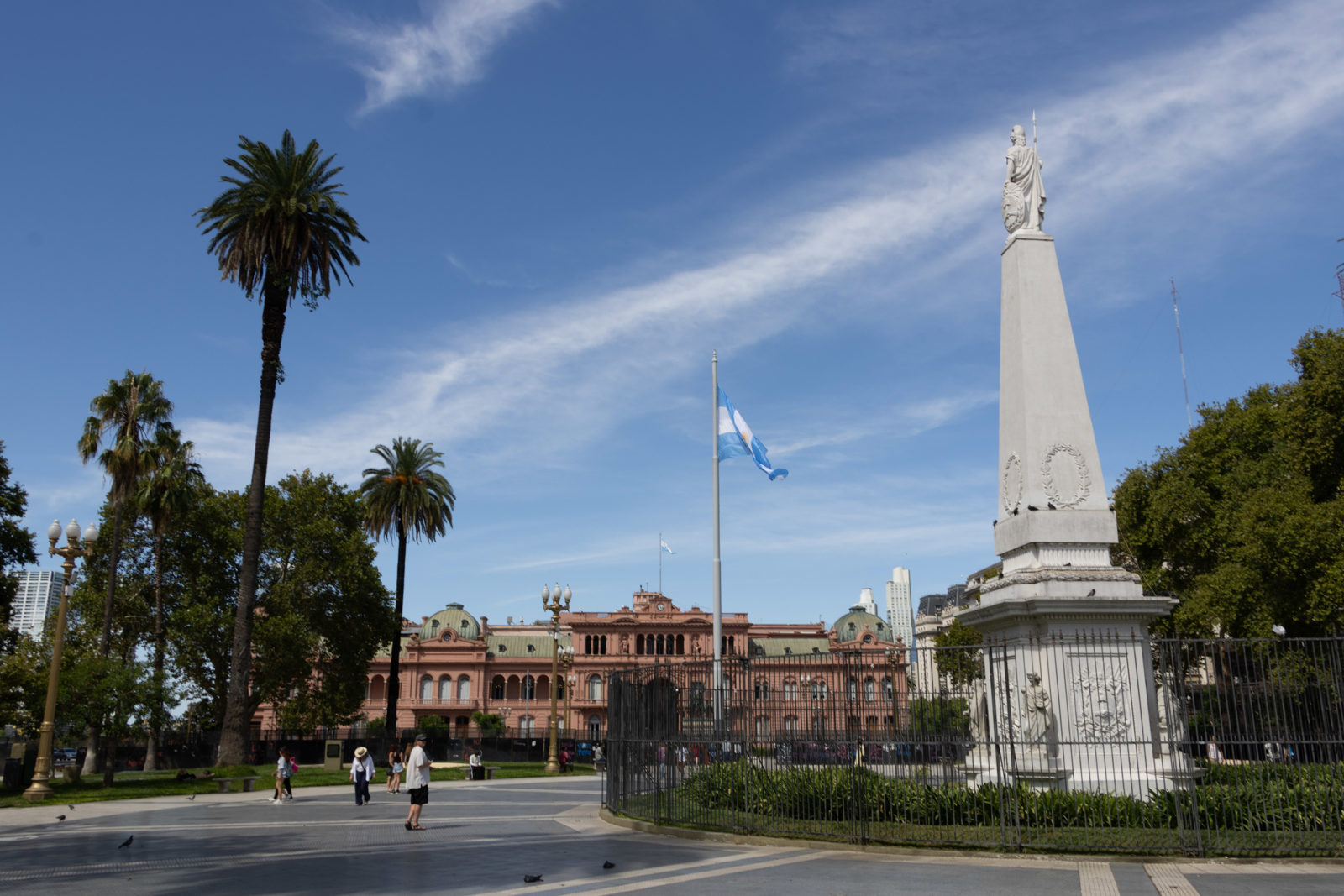 Plaza de Mayo in Buenos Aires with the Casa Rosada, Argentine flag and central monument.