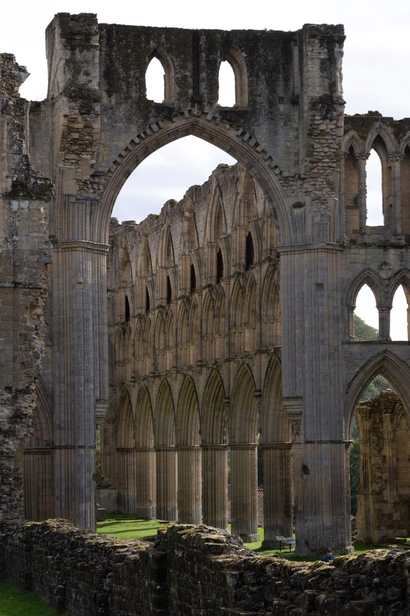 Gothic arches and stone ruins of Rievaulx Abbey in North Yorkshire