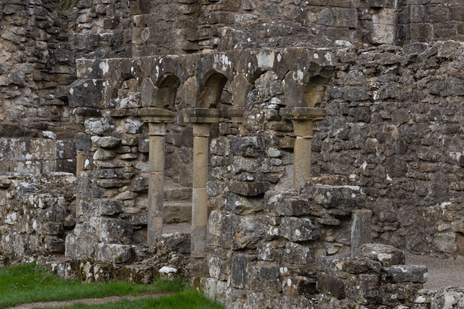 Close view of rough stone masonry and narrow openings at Rievaulx Abbey